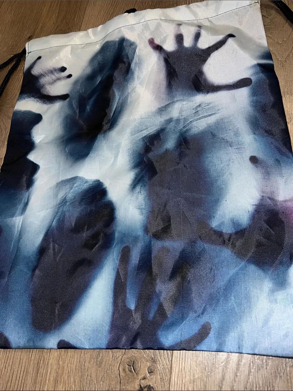 Men's Drawstring Halloween Spooky Backpack with Blue and Black Handprint Design